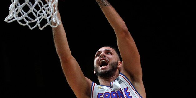 France's Evan Fournier dunks a basket during the EuroBasket European Basketball Championships match, round of sixteen, between France against Turkey, on Saturday, Sept. 12, 2015 in Lille, northern France. (AP Photo/Michel Spingler)