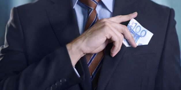 Cropped image of a businessman with a lot of cash