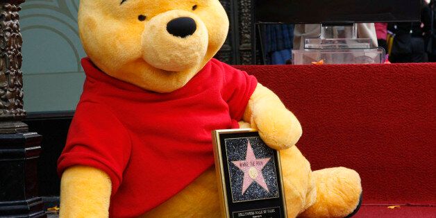 Winnie the Pooh poses for a photo during a ceremony Tuesday, April 11, 2006, celebrating his 80th anniversary with a star on the Hollywood Walk of Fame in Los Angeles. Pooh, created in the 1920's by British author A.A. Milne, debuted as a cartoon character in the 1966 Disney featurette
