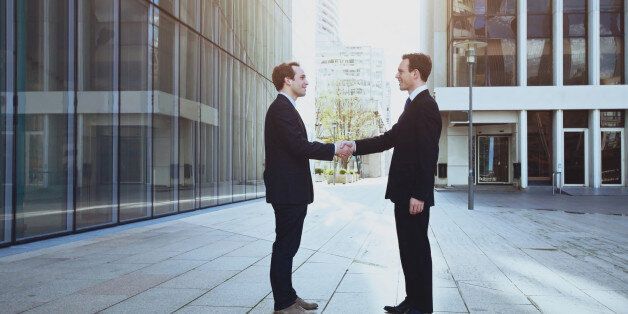 cooperation concept, handshake of two business men