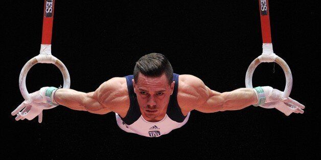 Greek gymnast Eleftherios Petrounias performs on the rings during day one of the Women and Men's Apparatus Final at the 2015 World Gymnastics Championships in Glasgow, Scotland, on October 31, 2015. AFP PHOTO / ANDY BUCHANAN (Photo credit should read Andy Buchanan/AFP/Getty Images)