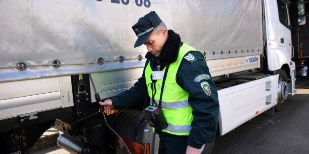 A Bulgarian border policeman checks the levels of oxygen in a truck to see if there is any illegal transport at the Kapitan Andreevo border crossing point between Bulgaria and Turkey on February 11, 2011. Bulgaria and Romania must take as much time as they need in order to get one hundred percent ready for joining the Schengen Area, which will probably not be just a few months, according to the French EU affairs minister. AFP PHOTO / DIMITAR DILKOFF (Photo credit should read DIMITAR DILKOFF/AFP/Getty Images)