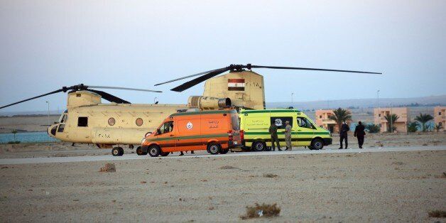 SUEZ, EGYPT - OCTOBER 31: Egyptian officials receives the corpses of 34 passengers, found at crash site of Russian Airliner, at Kabret Military Base in Suez, Egypt on October 31, 2015. A Russian Airbus-321 airliner with 224 people aboard crashed in Egypt's Sinai Peninsula on Saturday, according to the Egyptian Prime Minister's office. According to Egypts Civil Aviation Authority, the plane lost contact with air-traffic controllers shortly after taking off from the Egyptian Red Sea resort city of Sharm el-Sheikh en route to St Petersburg. (Photo by Alaa El Kassas/Anadolu Agency/Getty Images)