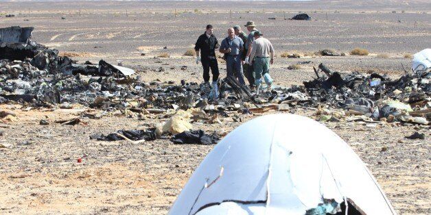 SUEZ, EGYPT - NOVEMBER 01: Russian officials inspect the crash site of Russian Airliner in Suez, Egypt on November 01, 2015. A Russian Airbus-321 airliner with 224 people aboard crashed in Egypt's Sinai Peninsula on yesterday. According to Egypts Civil Aviation Authority, the plane had been lost contact with air-traffic controllers shortly after taking off from the Egyptian Red Sea resort city of Sharm el-Sheikh en route to St Petersburg. (Photo by Mostafa El Shemy/Anadolu Agency/Getty Images)