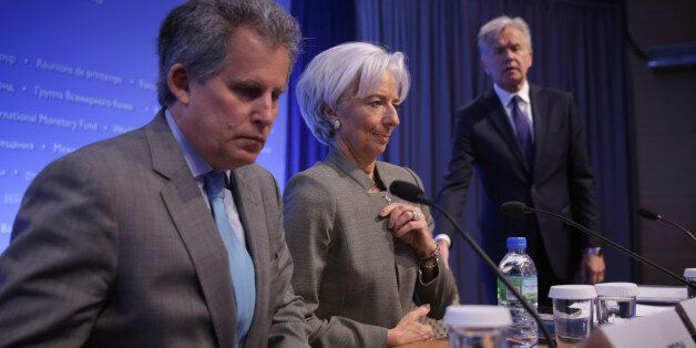 WASHINGTON, DC - APRIL 16: International Monetary Fund (IMF) Managing Director Christine Lagarde (C), First Managing Director David Lipton (L) and director of communications Gerry Rice take their seats during a news conference April 16, 2015 in Washington, DC. The World Bank Group and the IMF are holding their 2015 Spring Meetings. (Photo by Alex Wong/Getty Images)