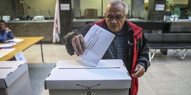 ZAGREB, CROATIA - NOVEMBER 08: A Croatian man casts his ballot for the parliamentary elections at a polling station in Zagreb, Croatia on November 08, 2015. (Photo by Kemal Zorlak/Anadolu Agency/Getty Images)