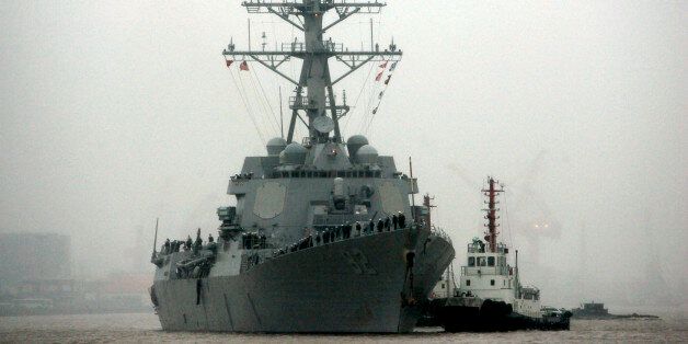 In this April 8, 2008, file photo, guided missile destroyer USS Lassen arrives at the Shanghai International Passenger Quay in Shanghai, China, for a scheduled port visit. The U.S. Navy's challenge late October 2015 to China's sovereignty claims in the South China Sea was not designed as a military threat, Adm. Harry B. Harris Jr. said Tuesday, Nov. 3, 2015, in a mostly upbeat speech about prospects for preventing U.S.-China disputes from escalating to conflict. Harris said the decision to send the USS Lassen into the South China Sea near Subi Reef, within the 12-nautical-mile (22-kilometer) territorial limit claimed by China, was meant to demonstrate the principle of freedom of navigation. (AP Photo/Eugene Hoshiko, File)