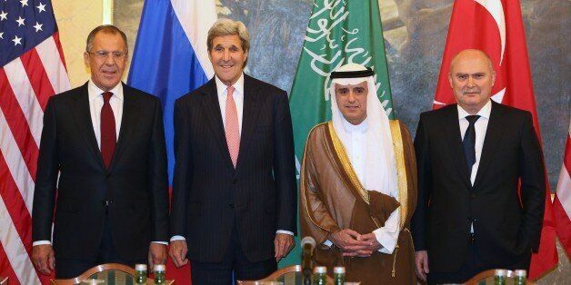 VIENNA, AUSTRIA - OCTOBER 29: United States Secretary of State John Kerry (2nd L), Foreign Minister of Turkey Feridun Sinirlioglu (R), Foreign Minister of Russia Sergei Lavrov (L) and Foreign Minister of Saudi Arabia Adel al-Jubeir (2nd R) pose before a joint meeting in Vienna, Austria on October 29, 2015. (Photo by Turkish Foreign Ministry / Cengizi Oguz Gumrukcu/Anadolu Agency/Getty Images)