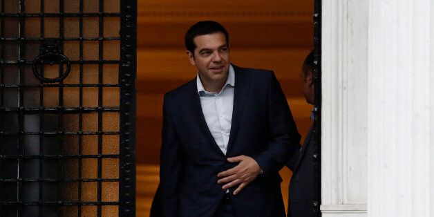 Alexis Tsipras, Greece's prime minister, leaves Maximos Mansion following a cabinet meeting in Athens, Greece, on Sunday, June 21, 2015. Greek Prime Minister Alexis Tsipras has made an offer to European Union leaders he described as a 'definitive' solution ahead of Mondays emergency summit. Photographer: Kostas Tsironis/Bloomberg via Getty Images