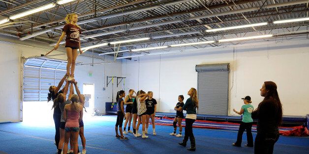 THORNTON, CO - OCTOBER 5: Students with Horizon High School train at Empire Athletics on October 5, 2015, in Thornton, Colorado. Empire Athletics offers classes in gymnastics and cheerleading. (Photo by Anya Semenoff/The Denver Post via Getty Images)