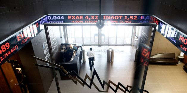 Greek stock prices flash along an electronic ticker screen inside the Athens Stock Exchange SA in Athens, Greece, on Friday, Aug. 21, 2015. The return on Greek bonds this quarter through Aug. 20 followed a 26 percent loss in the first six months, according to Bloomberg World Bond Indexes. Photographer: Kostas Tsironis/Bloomberg via Getty Images