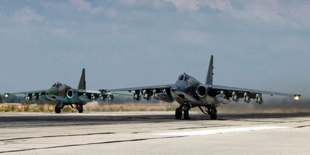 In this photo made from the footage taken from Russian Defense Ministry official web site on Tuesday, Oct. 6, 2015, two Russian SU-25 ground attack aircrafts take off from an airbase Hmeimim in Syria. A spokeswoman for the Russian foreign ministry has rejected claims that Russia in its airstrikes in Syria is targeting civilians or opposition forces. (Russian Defense Ministry Press Service via AP)