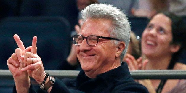 Actor Dustin Hoffman gestures during the second half of an NBA basketball game between the Washington Wizards and the New York Knicks at Madison Square Garden in New York, Thursday, Dec. 25, 2014. The Wizards defeated the Knicks 102-91. (AP Photo/Kathy Willens)