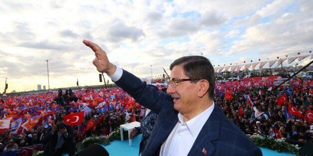 ISTANBUL, TURKEY - OCTOBER 25: Turkish Prime Minister and Justice and Development (AK) Party leader, Ahmet Davutoglu salutes citizens during an election campaign rally at Yenikapi Square in Istanbul, Turkey on October 25, 2015. Snap elections in Turkey will be held on November 1, nearly five months after an inconclusive election on June 7 saw no single party win an overall majority. (Photo by Hakan Goktepe/Anadolu Agency/Getty Images)