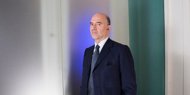 Pierre Moscovici, economic commissioner for the European Union (EU), poses for a photograph following a Bloomberg Television interview in Paris, France, on Wednesday, July 8, 2015. European leaders talked openly about a Greek exit from the euro ahead of a weekend summit on the country's economic future, breaking dramatically with years of denial about the possibility. Photographer: Christophe Morin/Bloomberg via Getty Images