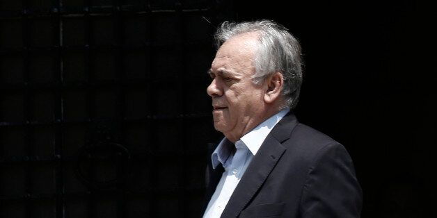 Yannis Dragasakis, Greece's deputy prime minister, leaves Maximos Mansion following a meeting with Alexis Tsipras, Greece's prime minister, in Athens, Greece, on Sunday, June 28, 2015. Greek bank executives and European officials are warning of an imminent cash crunch or bank shutdown after talks on a new aid package collapsed. Photographer: Kostas Tsironis/Bloomberg via Getty Images