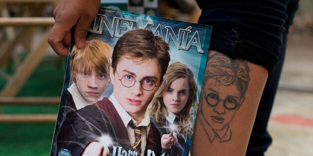 In this Sept. 29, 2015 photo, a Harry Potter fan shows off her tattoo during the inauguration of