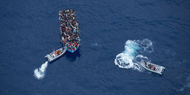 June 7, 2014 - Mediterranean Sea / Italy: Italian navy rescues asylum seekers traveling by boat off the coast of Africa. More than 2,000 migrants jammed in 25 boats arrived in Italy June 12, ending an international operation to rescue asylum seekers traveling from Libya. They were taken to three Italian ports and likely to be transferred to refugee centers inland. Hundreds of women and dozens of babies, were rescued by the frigate FREMM Bergamini as part of the Italian navy's "Mare Nostrum&
