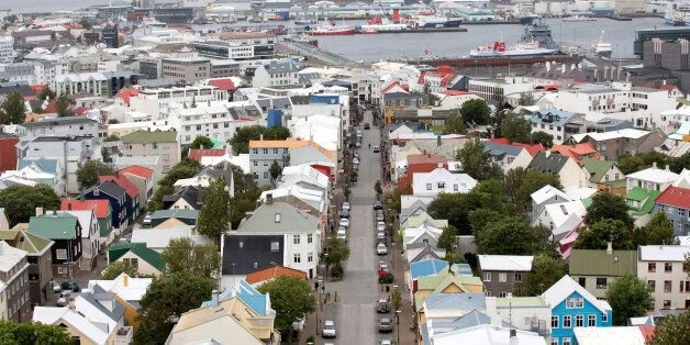 Multicolored rooftops and the harbour are seen on the city skyline in Reykjavik, Iceland, on Friday, Aug. 10, 2012. Iceland is betting its decision two years ago to force bondholders to pay for the banking system's collapse may help it rebound faster than Ireland. Photographer: Arnaldur Halldorsson/Bloomberg via Getty Images