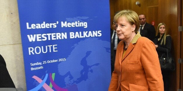 Germany's Chancellor Angela Merkel arrives at an European leader's meeting on refugee flows along the Western Balkans route at the European Commission in Brussels on October 25, 2015. European Union and Balkan leaders faced a make-or-break summit today on the deepening refugee crisis after three frontline states threatened to close their borders if their EU peers stopped accepting migrants. AFP PHOTO / EMMANUEL DUNAND (Photo credit should read EMMANUEL DUNAND/AFP/Getty Images)