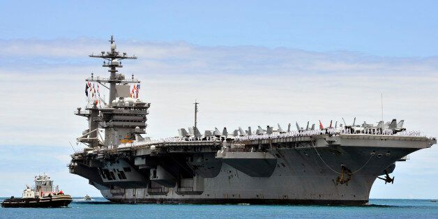PEARL HARBOR (May 27, 2015) The aircraft carrier USS Carl Vinson (CVN 70) arrives at Joint Base Pearl Harbor-Hickam for a port visit while in transit to its homeport of San Diego. Carl Vinson and its embarked air wing, Carrier Air Wing (CVW) 17, are returning from a nearly 10-month deployment that included supporting Operation Inherent Resolve in the U.S. 5th Fleet area of operations, and theater security cooperation and presence activities in U.S. 7th Fleet. (U.S. Navy photo by Mass Communication Specialist 2nd Class Jeff Troutman/Released)