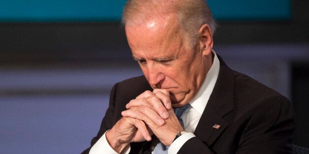 Vice President Joe Biden pauses at George Washington University in Washington, Tuesday, Oct. 20, 2015, during a forum to honor the legacy of former Vice President Walter Mondale. (AP Photo/Molly Riley)