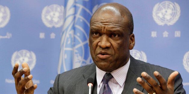 FILE - In this Sept. 17, 2013, file photo, Ambassador John Ashe, of Antigua and Barbuda, the president of the General Assembly's 68th session, speaks during a news conference at United Nations headquarters. Ashe accepted more than $500,000 in bribes from a Chinese real estate mogul and other businesspeople in exchange for help obtaining lucrative investments and government contracts, according to federal court documents unsealed Tuesday, Oct. 6, 2015. (AP Photo/Richard Drew, File)