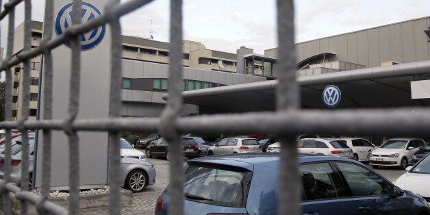 Cars are parked at a Volkswagen dealer in Milan, Italy, Thursday, Oct. 15, 2015. Italian authorities have searched the headquarters of Volkswagen Italia as part of a local investigation into the emissions testing scandal at the German automaker. The financial police in the northern city of Verona conducted the searches on Thursday and confirmed that there are officials under investigation. (AP Photo/Luca Bruno)