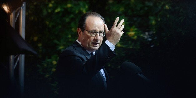 French President Francois Hollande makes a speech to the French community on October 23, 2015 in Athens, as part of a two days official visit in Greece. Hollande pledged to help Greece carry out its bailout reforms by modernising its state and tax administration. 'France must continue to stand by Greece,' Hollande told reporters after signing a strategic partnership with Greek Prime Minister Alexis Tsipras to provide French management expertise. AFP PHOTO / ALAIN JOCARD (Photo credit should read ALAIN JOCARD/AFP/Getty Images)