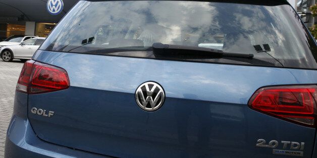 A Volkswagen Golf 2.0 TDI is parked at a Volkswagen dealer in Milan, Italy, Thursday, Oct. 15, 2015. Italian authorities have searched the headquarters of Volkswagen Italia as part of a local investigation into the emissions testing scandal at the German automaker. The financial police in the northern city of Verona conducted the searches on Thursday and confirmed that there are officials under investigation. (AP Photo/Luca Bruno)