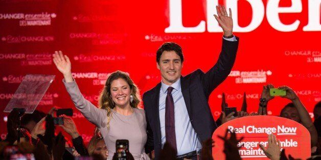 Canadian Liberal Party leader Justin Trudeau and his wife Sophie wave on stage in Montreal on October 20, 2015 after winning the general elections. AFP PHOTO/NICHOLAS KAMM (Photo credit should read NICHOLAS KAMM/AFP/Getty Images)