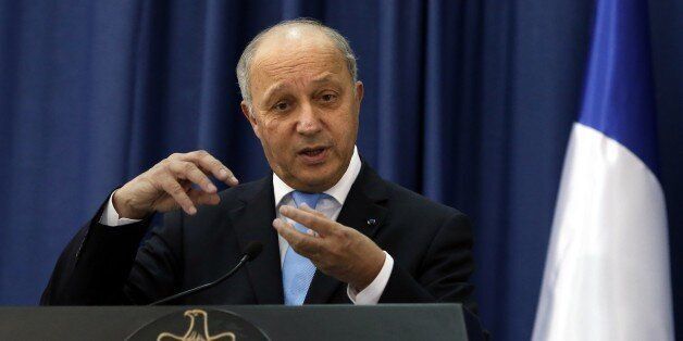 French Foreign Minister Laurent Fabius gestures as he speaks to journalists during a press conference following a meeting with Palestinian President Mahmud Abbas (unseen) at the Mukataa compound, in the West Bank city of Ramallah, on June 21, 2015. Fabius, during a visit to Cairo earlier in the week, urged the resumption of Middle East peace talks, while warning that continued Israeli settlement building on land the Palestinians want for a future state would damage chances of a final deal. AFP PHOTO / THOMAS COEX (Photo credit should read THOMAS COEX/AFP/Getty Images)