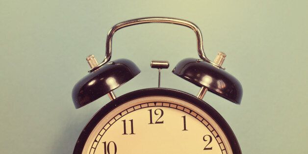 Vintage alarm clock on wall