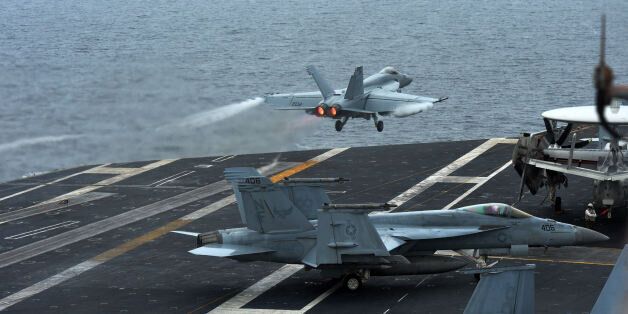 A U.S. F18 Hornet fighter attack aircraft is launched off the deck of the U.S. nuclear-powered aircraft carrier, USS George Washington during a military exercise off South Korea's West Sea, Wednesday, July 16, 2014. A day after launching two ballistic missiles from a base near the border with archrival South Korea, Pyongyang on Monday fired a barrage of artillery shells into waters near its eastern sea border with the South. Officials in Seoul have confirmed nearly 100 missile, rocket and artillery tests by North Korea this year, an output seen as significantly higher than past years. (AP Photo/Korea Pool) KOREA OUT