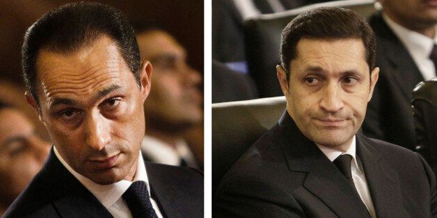 FILE - This combination of Jan. 6, 2011 file images shows Gamal Mubarak, left, and Alaa Mubarak, right, attending a Christmas Eve Mass at the Coptic cathedral in Cairo, Egypt. An Egyptian court on Monday, Oct. 12, 2015, has ordered the release of the sons of deposed autocrat Hosni Mubarak, Gamal, Mubarak's one-time heir apparent, and his brother Alaa, a wealthy businessman, after time served on a corruption conviction. Their father remains held in a military hospital. (AP Photo/File)
