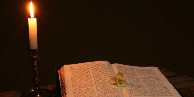 bible prayer book candle