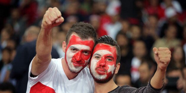 Soccer fans of Turkey's react before their Euro 2016 Group A qualifying match between Turkey and Iceland at the Buyuksehir Torku Arena Stadium in Konya, Turkey, Tuesday, Oct. 13, 2015.(AP Photo)