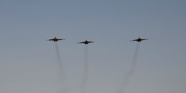 Russian fighter jets arrive at al-Muthanna air base in Baghdad, Iraq, Tuesday, July 1, 2014. Iraq is increasingly turning to other governments like Iran, Russia and Syria to help beat back a rampant insurgency because it cannot wait for additional American military aid, Baghdad's top envoy to the U.S. said Tuesday.(AP Photo)