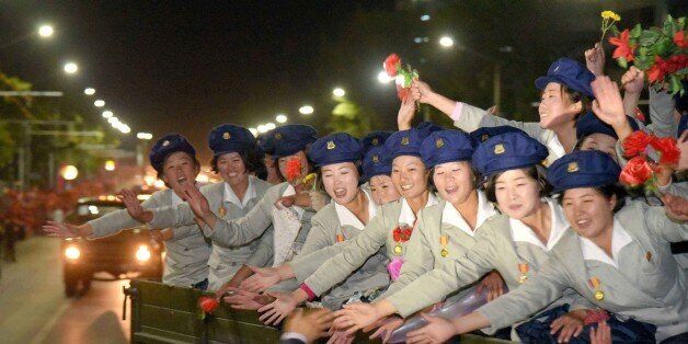 This photo taken on October 10 and released on October 11 by North Korea's official Korean Central News Agency (KCNA) shows North Korean women soldiers gesturing after the military parade to celebrate the 70th anniversary of North Korean ruling Workers' Party in Pyongyang. - - - REPUBLIC OF KOREA OUT AFP PHOTO / KCNA via KNSTHIS PICTURE WAS MADE AVAILABLE BY A THIRD PARTY. AFP CAN NOT INDEPENDENTLY VERIFY THE AUTHENTICITY, LOCATION, DATE AND CONTENT OF THIS IMAGE. THIS PHOTO IS DISTRIBUTED EX