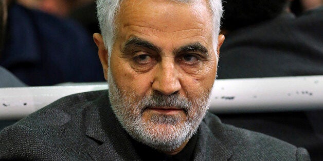 FILE - In this Friday, March 27, 2015 file photo released by an official website of the office of the Iranian supreme leader, commander of Iran's Quds Force, Qassem Soleimani, sits in a religious ceremony at a mosque in the residence of Supreme Leader Ayatollah Ali Khamenei, in Tehran, Iran. The chief of an elite unit in Iran's Revolutionary Guard has accused the U.S. of having