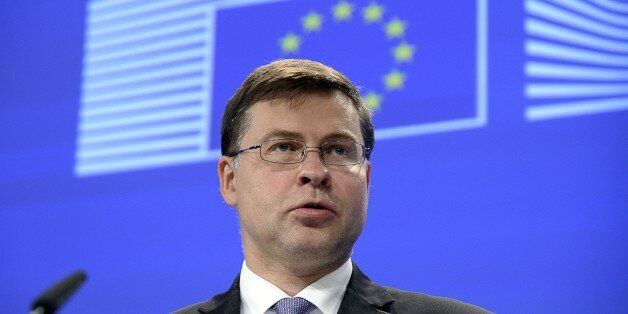 European Commission Vice-President for the Euro and Social Dialogue Valdis Dombrovskis delivers a press conference at the European Commission headquarters in Brussels on July 17, 2015. The European Union formally approved a short term-loan of 7.16 billion euros to Greece on July 17, while offering guarantees to non-euro nations that their taxpayers would not be at risk, Dombrovskis said. AFP PHOTO / THIERRY CHARLIER (Photo credit should read THIERRY CHARLIER/AFP/Getty Images)