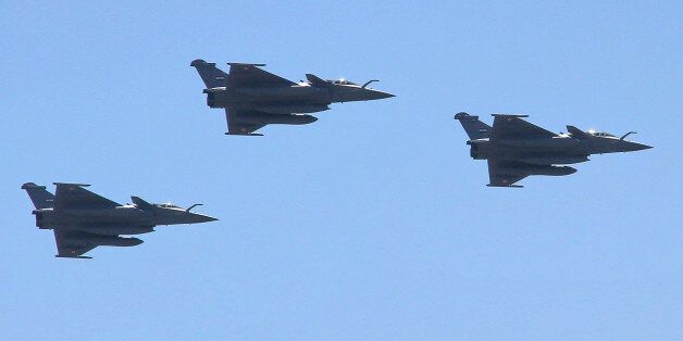 Three French made Rafale fighter jets fly in formation above Cairo, on Tuesday, July 21, 2015. Egypt took delivery of three Rafale fighter jets from France, the first of 24 warplanes purchased as part of a nearly $6 billion deal that also included an advanced frigate and munitions. (AP Photo/Ahmed Abd El Latif)