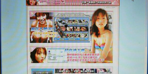 BEIJING, CHINA: A website shows a Chinese language porn site on the Internet in Beijing, 06 September 2004. China has beefed up its ongoing crackdown on Internet porn with new rules published that allow courts to issue life sentences to those convicted of posting pornography online. AFP PHOTO/Peter PARKS (Photo credit should read PETER PARKS/AFP/Getty Images)