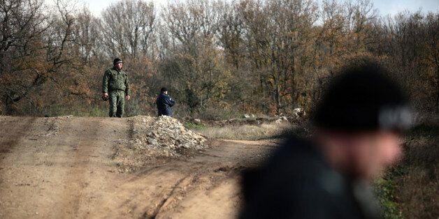 Border policemen stand guard at Bulgarian-Turkish border where most of the illegal immigrants enter, near the village of Golyam Dervent, Bulgaria Thursday, Nov., 28 2013. Bulgarian authorities are building fence over a section of its 274-kilometer (171 mile-) border with Turkey to prevent prevent illegal entry via the border. Bulgaria has seen a serious refugee influx over the past year as it is the gateway to the European Union for refugees fleeing Syria via Turkey. (AP Photo/Valentina Petrova)