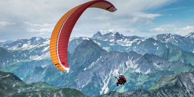 OBERSTDORF, GERMANY - JUNE 27: A Paraglider flies from Nebelhorn over the 'Allgaeu Alps' on June 27, 2015 in Oberstdorf, Germany. (Photo by Thomas Lohnes/Getty Images)