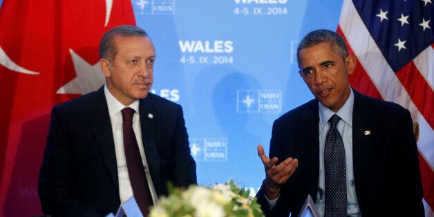 President Barack Obama speaks to reporters as he meets with Turkish President Recep Tayyip Erdogan at the NATO summit at Celtic Manor, Newport, Wales, Friday, Sept. 5, 2014. (AP Photo/Charles Dharapak)