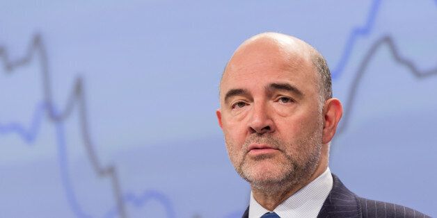 EU Commissioner for Economic and Financial Affairs, Taxation and Customs Pierre Moscovici addresses the media on the spring economic forecast at the European Commission headquarters in Brussels on Tuesday, May. 5, 2015. The European Union on Tuesday nudged up its forecast for economic growth across the 19-country eurozone despite a much gloomier outlook for Greece.(AP Photo/Geert Vanden Wijngaert)