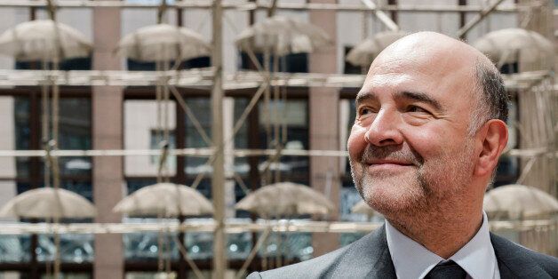 European Commissioner for the Economy Pierre Moscovici speaks with the media as he arrives for a meeting of the eurogroup finance ministers at the EU Council building in Brussels on Monday, May 11, 2015. Hopes for a deal between Greece and its European creditors at a key meeting Monday are slim, weighing on the region's stock markets as the country struggles to make upcoming debt repayments. (AP Photo/Geert Vanden Wijngaert)