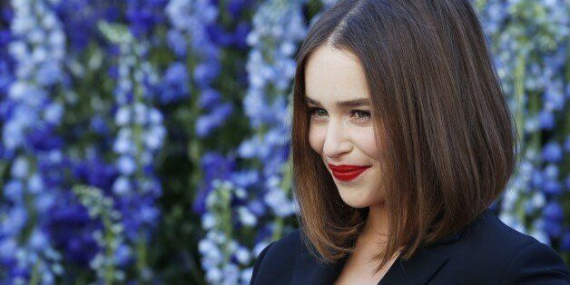 British actress Emilia Clarke poses prior to the start of the Christian Dior 2016 Spring/Summer ready-to-wear collection fashion show, on October 2, 2015 in Paris. AFP PHOTO / PATRICK KOVARIK (Photo credit should read PATRICK KOVARIK/AFP/Getty Images)
