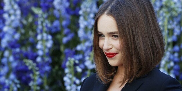 British actress Emilia Clarke poses prior to the start of the Christian Dior 2016 Spring/Summer ready-to-wear collection fashion show, on October 2, 2015 in Paris. AFP PHOTO / PATRICK KOVARIK (Photo credit should read PATRICK KOVARIK/AFP/Getty Images)